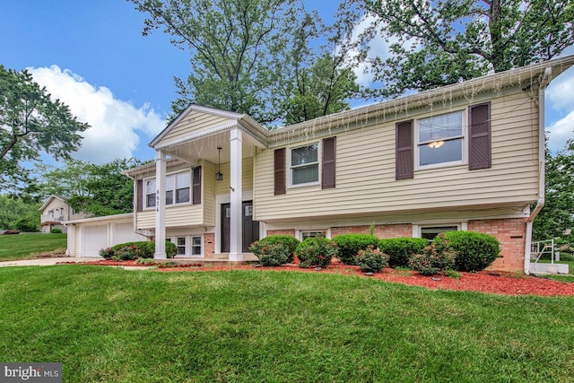 6614 Mccahill Dr, Laurel, MD 20707 - raised ranch featuring a front yard and brick siding