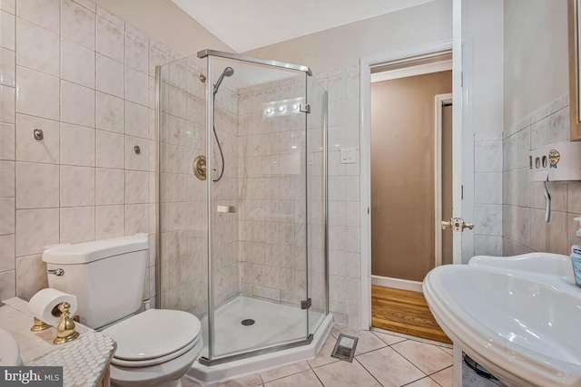 6614 Mccahill Dr, Laurel, MD 20707 - full bath featuring tile patterned flooring, tile walls, and a stall shower
