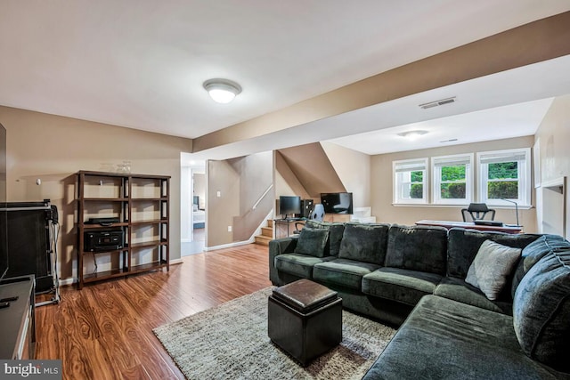 6614 Mccahill Dr, Laurel, MD 20707 - living area with wood finished floors and stairs