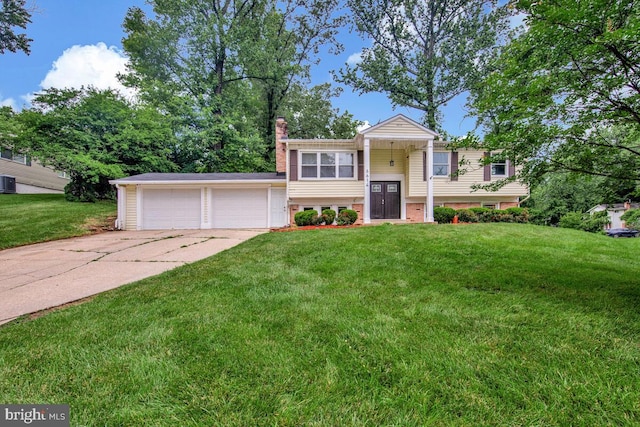 6614 Mccahill Dr, Laurel, MD 20707 - bi-level home with a chimney and a front yard