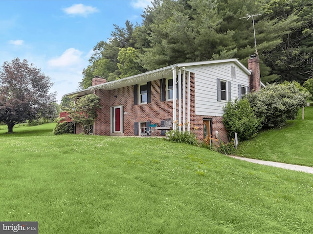 4704 Baughman Ml, Manchester, MD 21102 - view of front of home with a chimney, brick siding, and a front yard