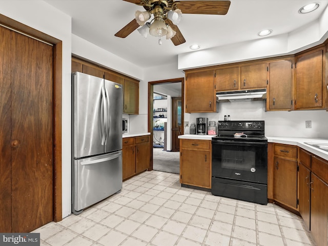 4704 Baughman Ml, Manchester, MD 21102 - kitchen featuring freestanding refrigerator, black electric range, under cabinet range hood, light countertops, and a ceiling fan