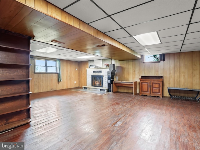 4704 Baughman Ml, Manchester, MD 21102 - below grade area with wooden walls, a fireplace, plenty of natural light, and wood finished floors