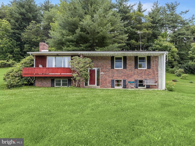 4704 Baughman Ml, Manchester, MD 21102 - raised ranch with a front yard, a chimney, and brick siding