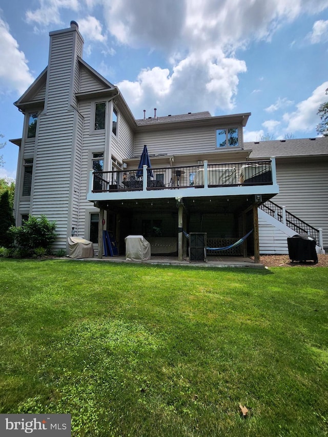 12024 Walnut Branch Rd, Reston, VA 20194 - rear view of house with a deck, a chimney, and a lawn