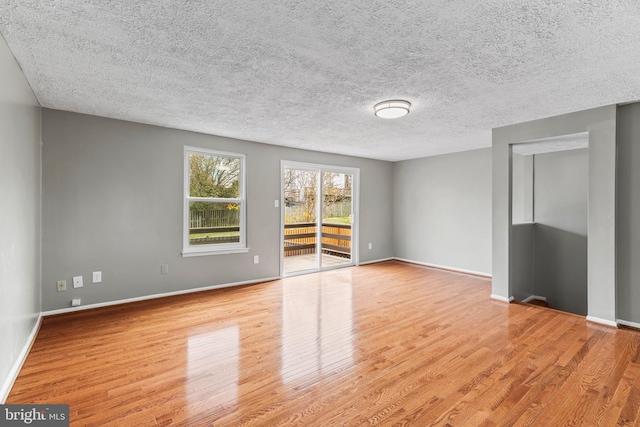 7451 Lone Star Rd, Lorton, VA 22079 - unfurnished room featuring wood finished floors and a textured ceiling