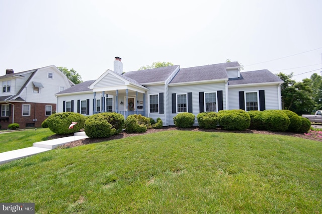 208 Bloomingdale Ave, Federalsburg, MD 21632 - view of front facade with a front yard, a chimney, and roof with shingles