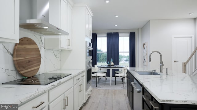 2664 River Birch Rd, Herndon, VA 20171 - kitchen with wall chimney exhaust hood, stainless steel appliances, decorative backsplash, white cabinets, and light wood-type flooring