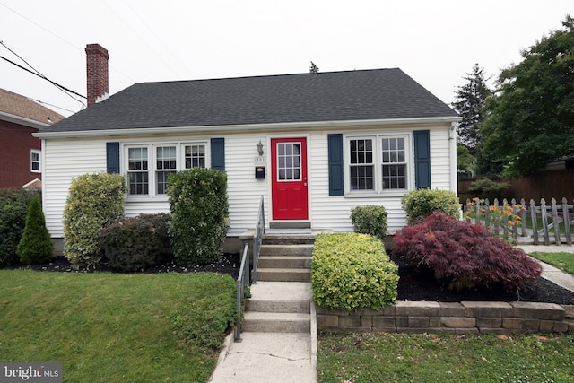 301 E Hanover St, Hanover, PA 17331 - cape cod home featuring a chimney, roof with shingles, and entry steps