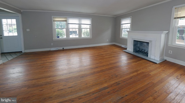 301 E Hanover St, Hanover, PA 17331 - unfurnished living room featuring hardwood / wood-style floors, healthy amount of natural light, and ornamental molding