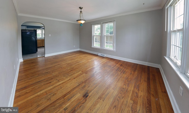 301 E Hanover St, Hanover, PA 17331 - unfurnished room with arched walkways, hardwood / wood-style flooring, and ornamental molding