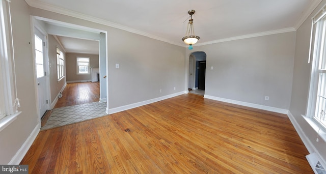 301 E Hanover St, Hanover, PA 17331 - unfurnished room with light wood finished floors, arched walkways, and ornamental molding