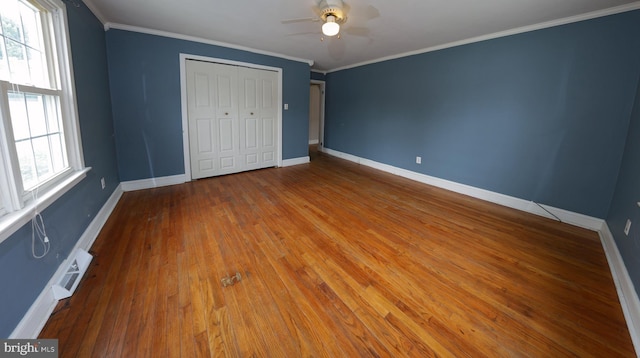 301 E Hanover St, Hanover, PA 17331 - unfurnished bedroom with wood finished floors, a closet, crown molding, and ceiling fan