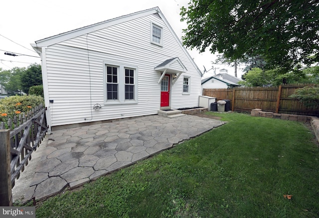 301 E Hanover St, Hanover, PA 17331 - back of property with a patio and a fenced backyard