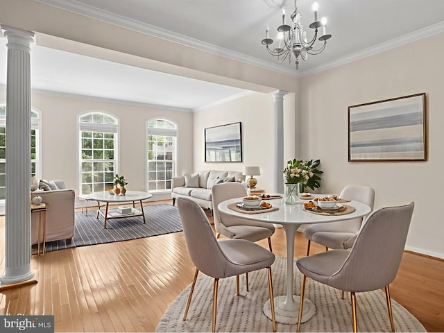 13595 Cedar Run Ln, Herndon, VA 20171 - dining space with decorative columns, hardwood / wood-style floors, crown molding, and a chandelier