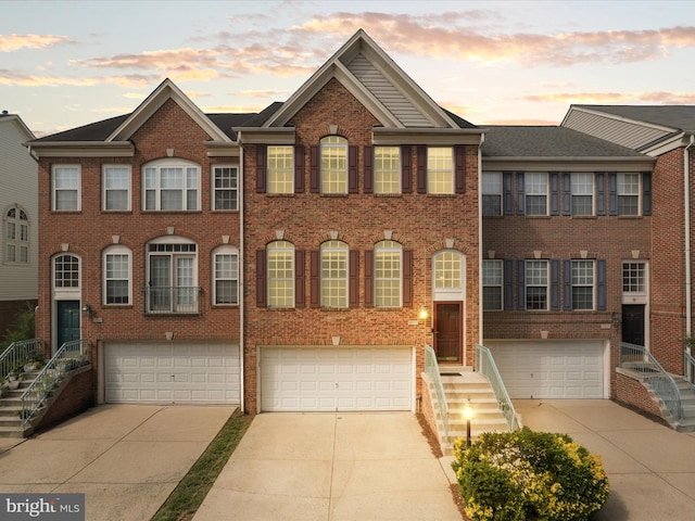 13595 Cedar Run Ln, Herndon, VA 20171 - view of front facade with concrete driveway, brick siding, and a garage
