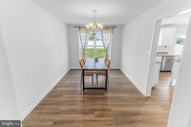 123 Hank Aaron Rd, Berkeley Springs, WV 25411 - dining area featuring a chandelier, plenty of natural light, and wood finished floors
