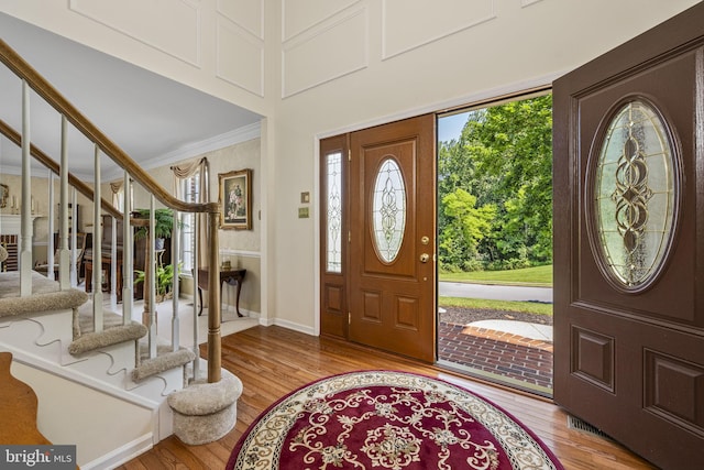 1043 Welsh Ayres Way, Downingtown, PA 19335 - foyer entrance featuring light wood-style flooring, crown molding, and stairs
