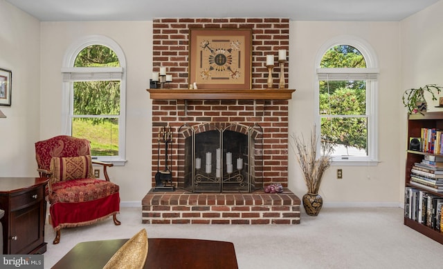 1043 Welsh Ayres Way, Downingtown, PA 19335 - carpeted living area with baseboards and a brick fireplace