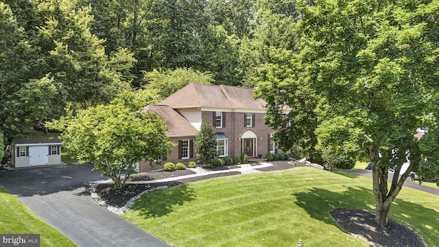 1043 Welsh Ayres Way, Downingtown, PA 19335 - colonial inspired home with brick siding, a front yard, and a storage shed
