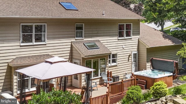 1043 Welsh Ayres Way, Downingtown, PA 19335 - back of property featuring a hot tub, roof with shingles, and a deck