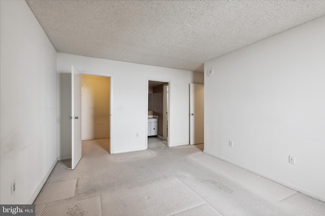 205 E Joppa Rd Unit 2401, Towson, MD 21286 - unfurnished bedroom with light colored carpet and a textured ceiling