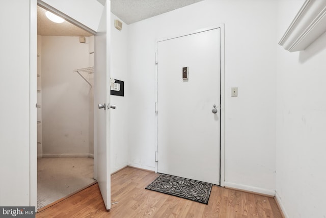 205 E Joppa Rd Unit 2401, Towson, MD 21286 - foyer with light wood-style floors and baseboards
