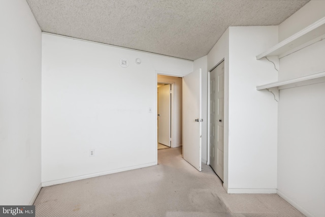 205 E Joppa Rd Unit 2401, Towson, MD 21286 - unfurnished bedroom with carpet floors, a closet, and a textured ceiling