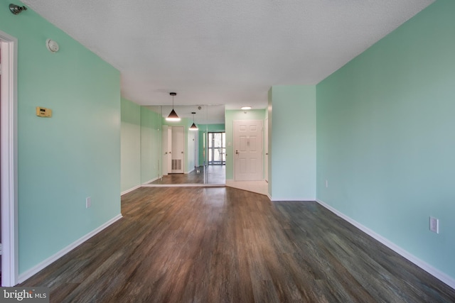 15115 Interlachen Dr Unit 3-1020, Silver Spring, MD 20906 - unfurnished living room with dark wood-style floors and baseboards
