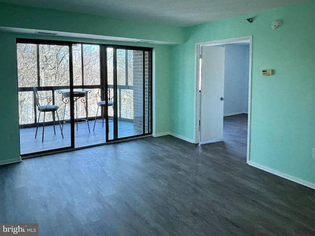15115 Interlachen Dr Unit 3-1020, Silver Spring, MD 20906 - spare room with dark wood-style flooring and a smoke detector