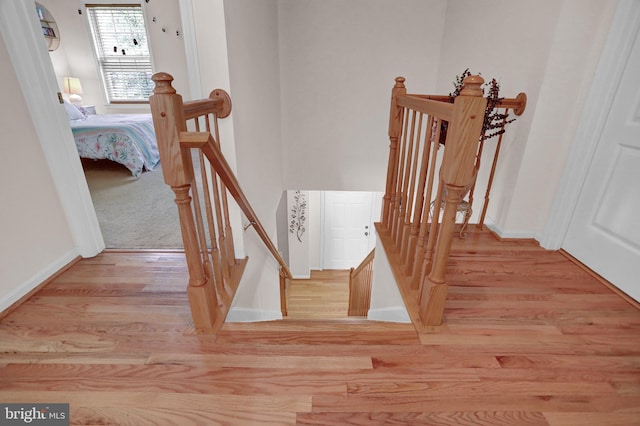 207 Weston Woods Dr, Pasadena, MD 21122 - staircase featuring wood finished floors and baseboards