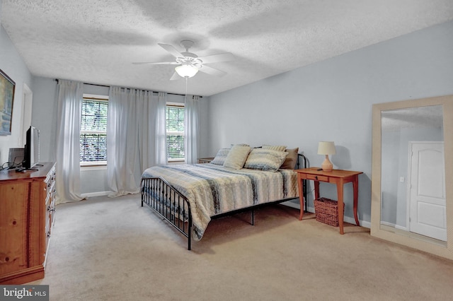 207 Weston Woods Dr, Pasadena, MD 21122 - bedroom featuring light colored carpet, a textured ceiling, and ceiling fan