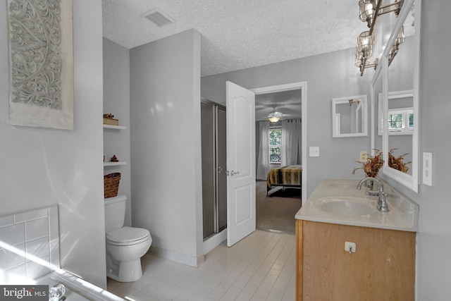 207 Weston Woods Dr, Pasadena, MD 21122 - ensuite bathroom with tile patterned floors, a stall shower, double vanity, healthy amount of natural light, and a textured ceiling