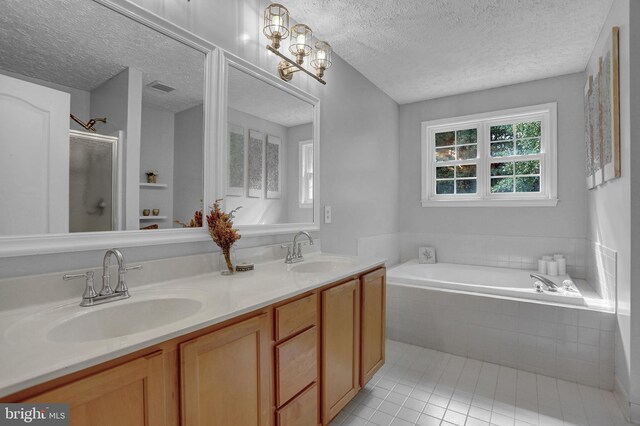 207 Weston Woods Dr, Pasadena, MD 21122 - full bathroom featuring a textured ceiling, a bath, double vanity, tile patterned flooring, and a stall shower