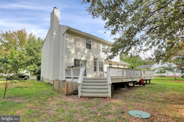 207 Weston Woods Dr, Pasadena, MD 21122 - rear view of property featuring a chimney, a lawn, and a deck