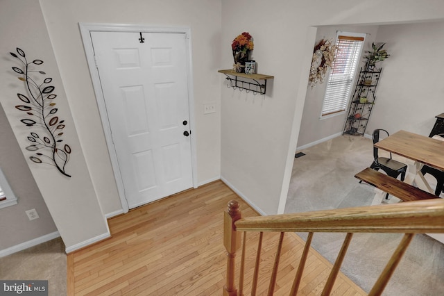 207 Weston Woods Dr, Pasadena, MD 21122 - entryway with baseboards and light wood-type flooring