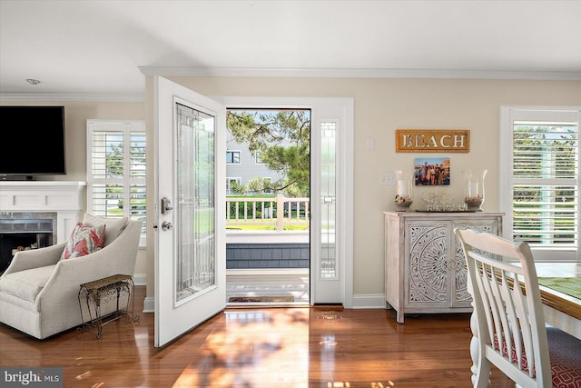 222 N Heron Dr Unit 222-1, Ocean City, MD 21842 - doorway to outside with ornamental molding, wood finished floors, and a fireplace
