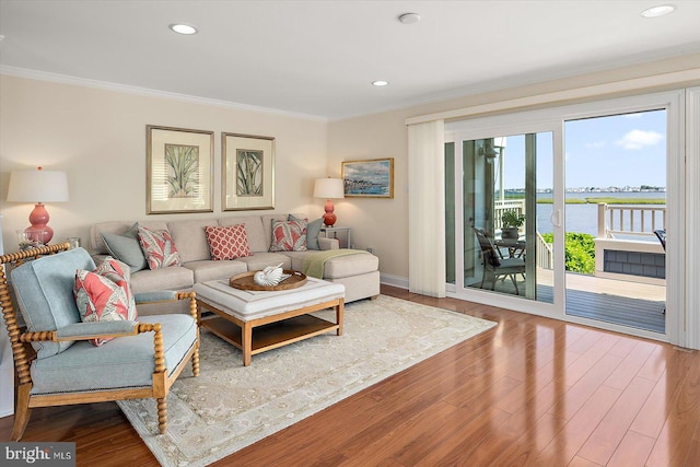 222 N Heron Dr Unit 222-1, Ocean City, MD 21842 - living area featuring crown molding, wood finished floors, a water view, and recessed lighting