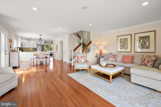 222 N Heron Dr Unit 222-1, Ocean City, MD 21842 - living area featuring light wood-type flooring, stairs, a chandelier, crown molding, and recessed lighting