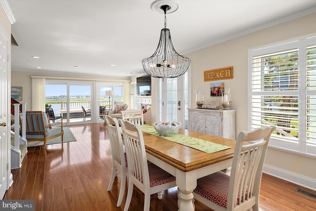 222 N Heron Dr Unit 222-1, Ocean City, MD 21842 - dining room featuring hardwood / wood-style flooring, ornamental molding, a chandelier, and recessed lighting