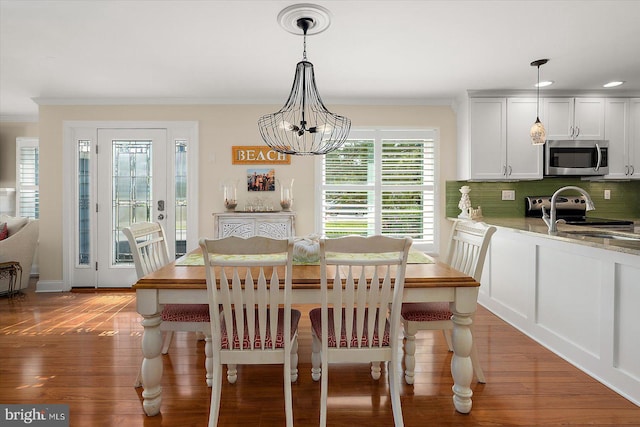 222 N Heron Dr Unit 222-1, Ocean City, MD 21842 - dining area featuring crown molding, light wood-style flooring, a chandelier, and recessed lighting