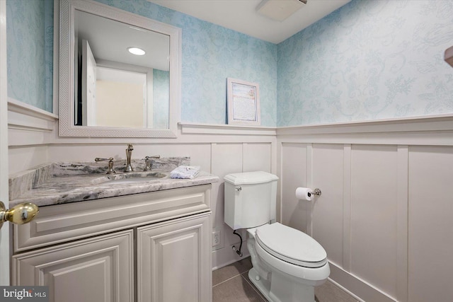 222 N Heron Dr Unit 222-1, Ocean City, MD 21842 - half bath with wallpapered walls, wainscoting, vanity, a decorative wall, and tile patterned floors