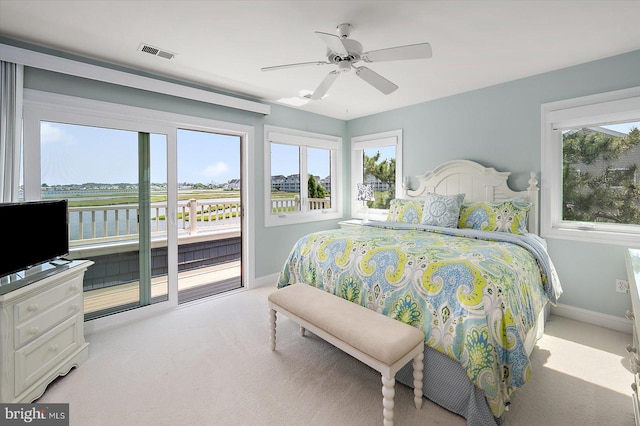 222 N Heron Dr Unit 222-1, Ocean City, MD 21842 - carpeted bedroom with access to exterior and ceiling fan