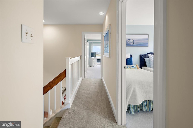 222 N Heron Dr Unit 222-1, Ocean City, MD 21842 - hall with carpet floors and an upstairs landing