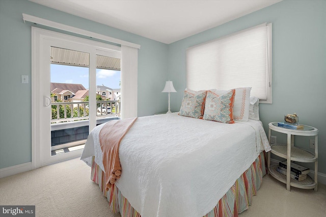 222 N Heron Dr Unit 222-1, Ocean City, MD 21842 - carpeted bedroom with access to exterior and baseboards