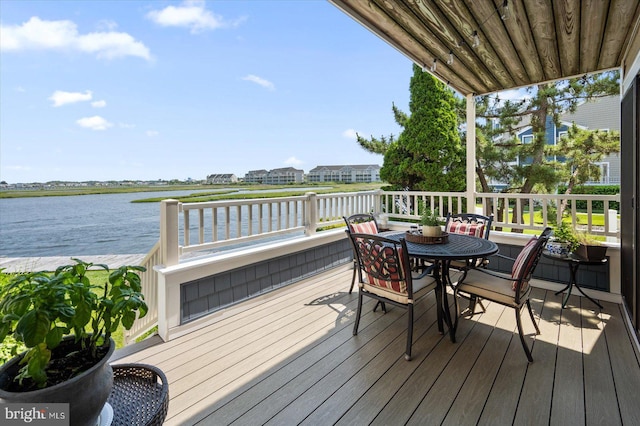 222 N Heron Dr Unit 222-1, Ocean City, MD 21842 - wooden deck featuring a water view and outdoor dining area