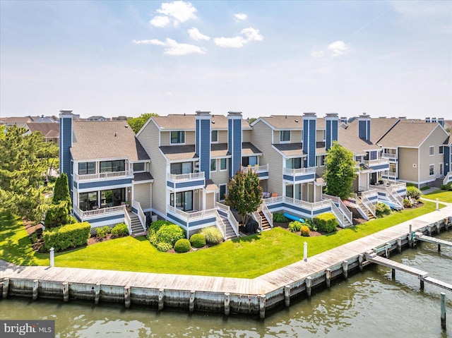 222 N Heron Dr Unit 222-1, Ocean City, MD 21842 - back of property with a water view, a residential view, and a lawn