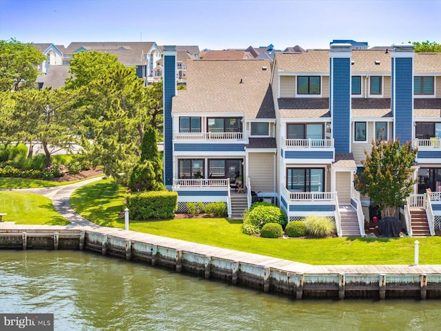 222 N Heron Dr Unit 222-1, Ocean City, MD 21842 - back of house with a shingled roof, a water view, stairs, and a residential view