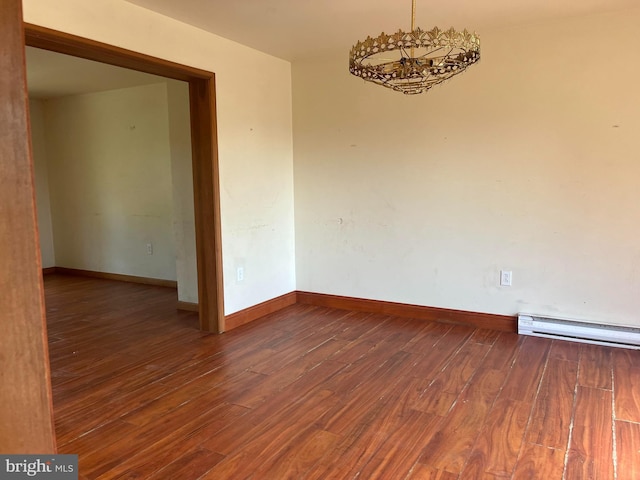 472 Lummistown Rd, Cedarville, NJ 08311 - spare room featuring a baseboard heating unit and wood finished floors