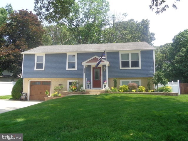 8402 Crofton Ln, Pennsauken, NJ 08109 - bi-level home featuring a garage, concrete driveway, and stucco siding